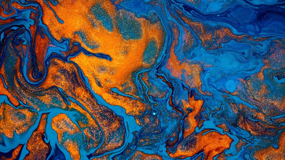 Fluid art texture. Abstract backdrop with mixing paint effect. Liquid acrylic artwork with chaotic mixed paints. Can be used for posters or wallpapers. Blue, orange and golden overflowing colors.