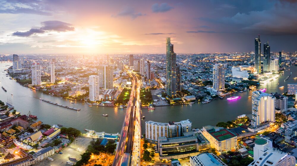 Aerial,View,Of,Bangkok,Skyline,And,Skyscraper,With,Light,Trails